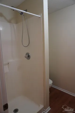 an empty room that has a view of bathroom