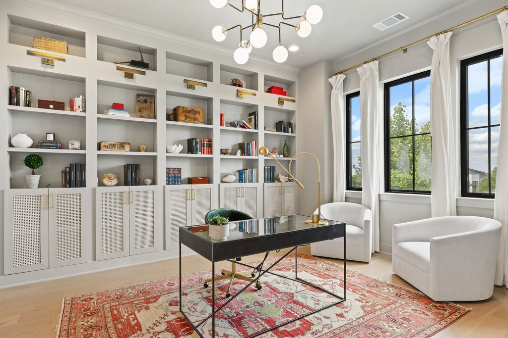 7516 Davenport Divide Road Austin, TX 78738 - Photo 16 of 40 The dedicated home office is equipped with stunning built-ins adding style and practicality to the room.
