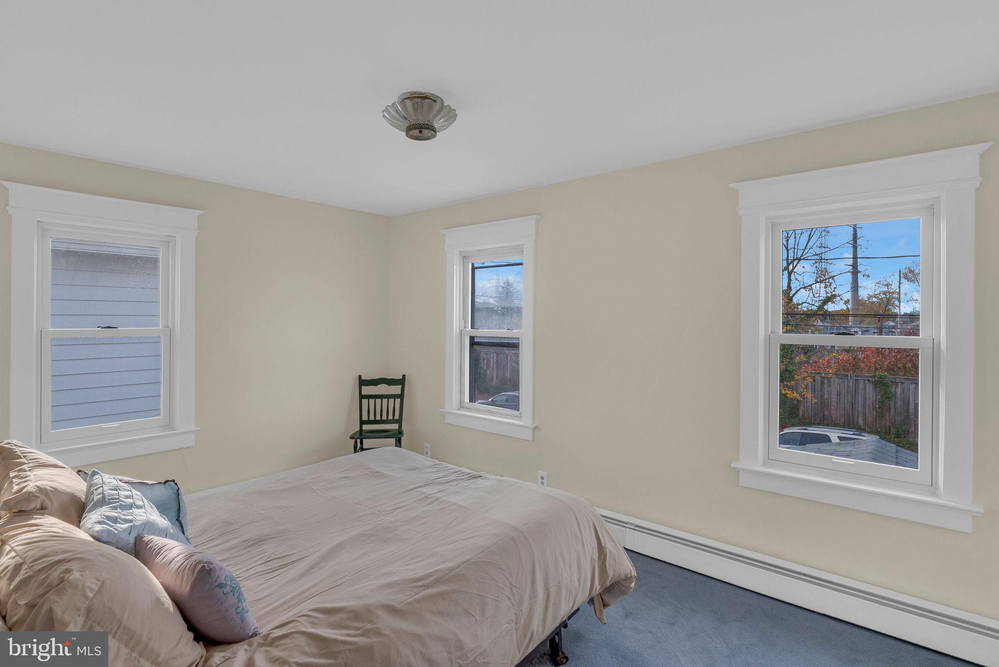 118 Hunter Avenue Hamilton, NJ 08610 - Photo 13 of 23 a bedroom with a bed and a window