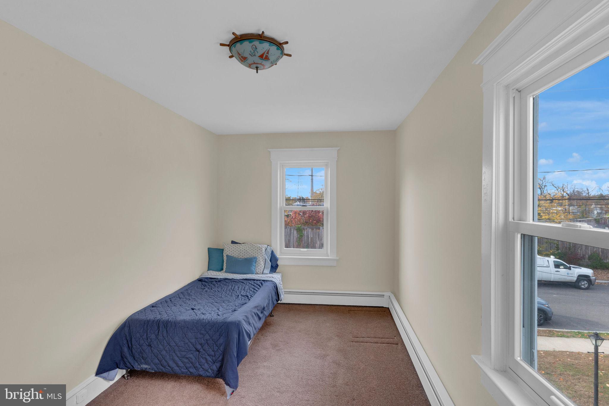 118 Hunter Avenue Hamilton, NJ 08610 - Photo 17 of 23 a living room with a couch and a window