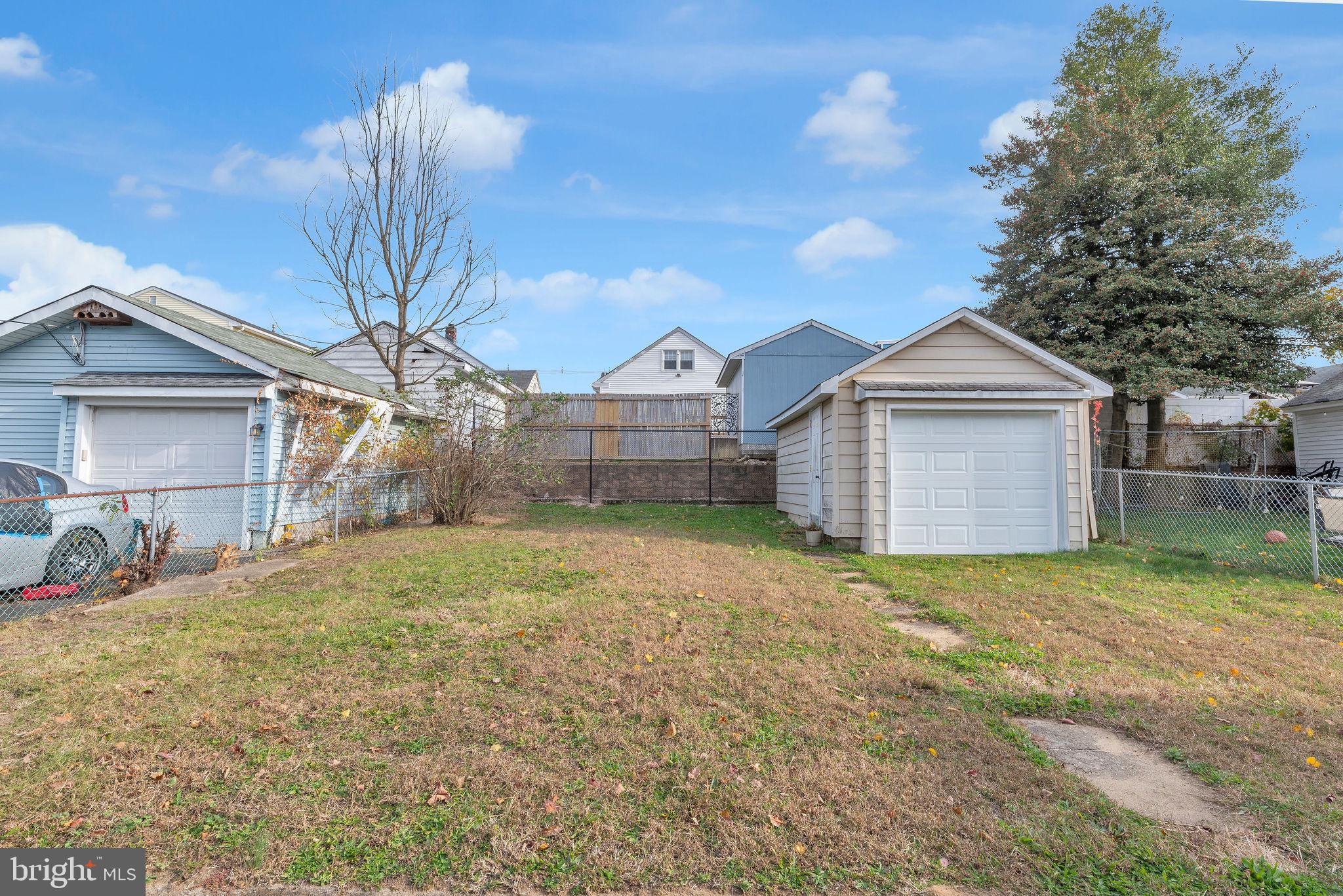 118 Hunter Avenue Hamilton, NJ 08610 - Photo 22 of 23 a view of a house with a yard and large tree