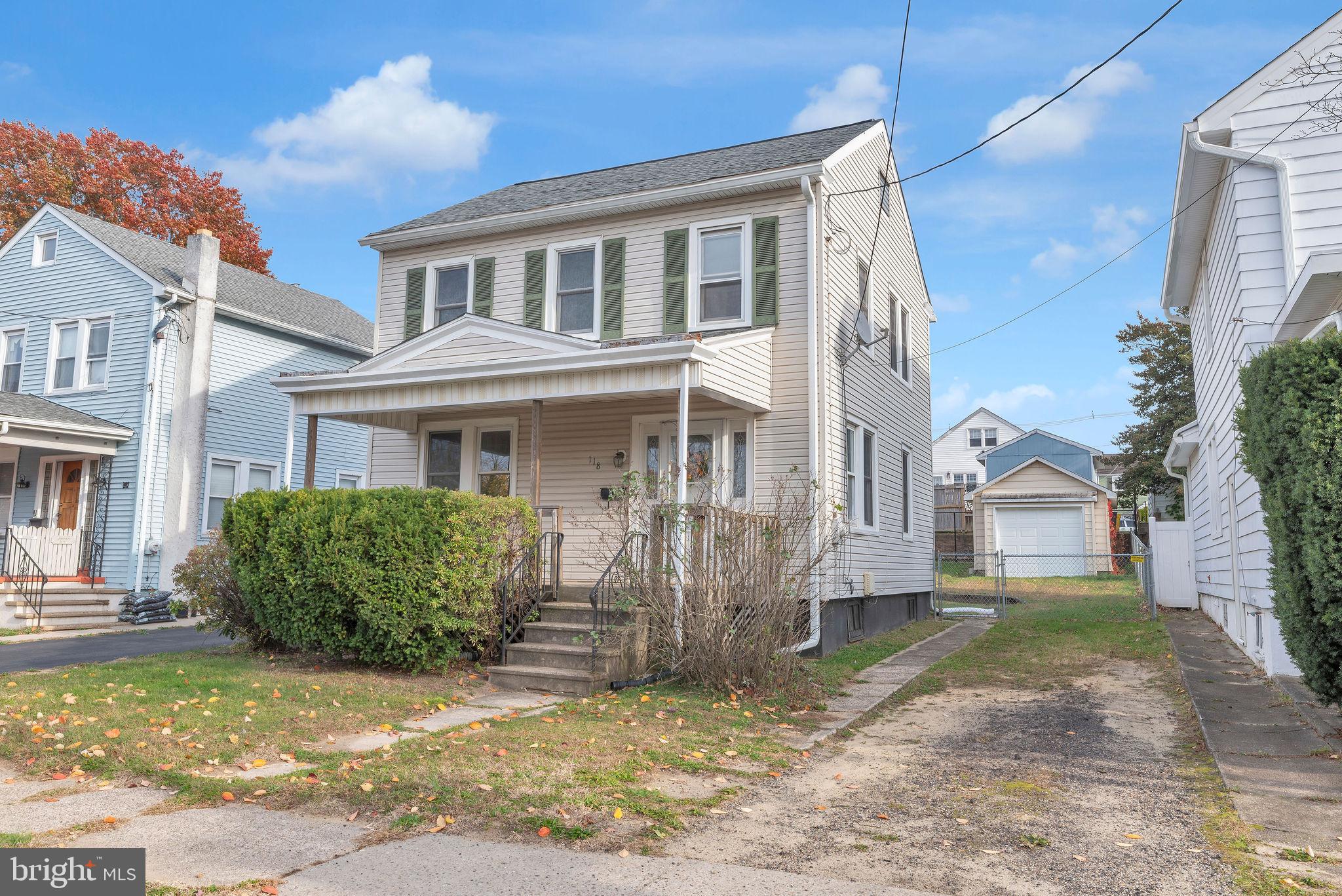 118 Hunter Avenue Hamilton, NJ 08610 - Photo 3 of 23 a view of a brick house with many windows next to a road