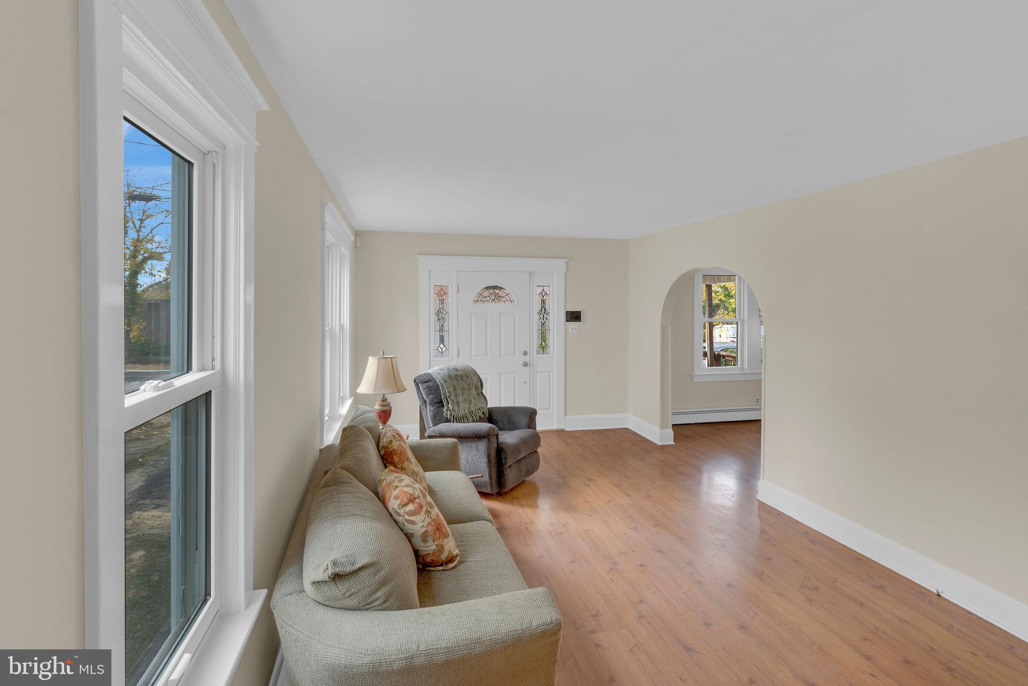 118 Hunter Avenue Hamilton, NJ 08610 - Photo 6 of 23 a living room with furniture and wooden floor