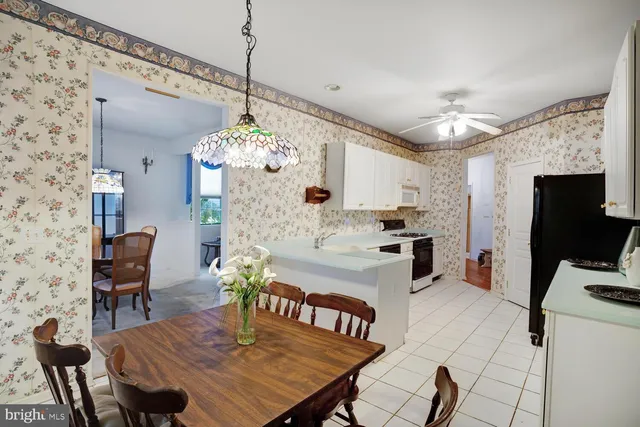 a very nice looking dining room with a table and chairs