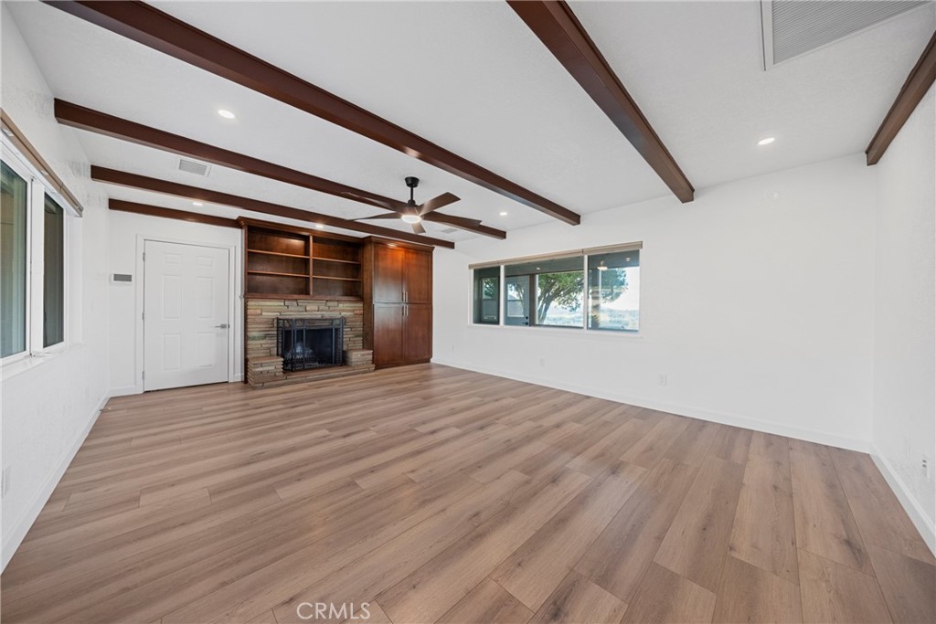12646 10th Street Yucaipa, CA 92399 - Photo 16 of 72 a view of empty room with wooden floor and window