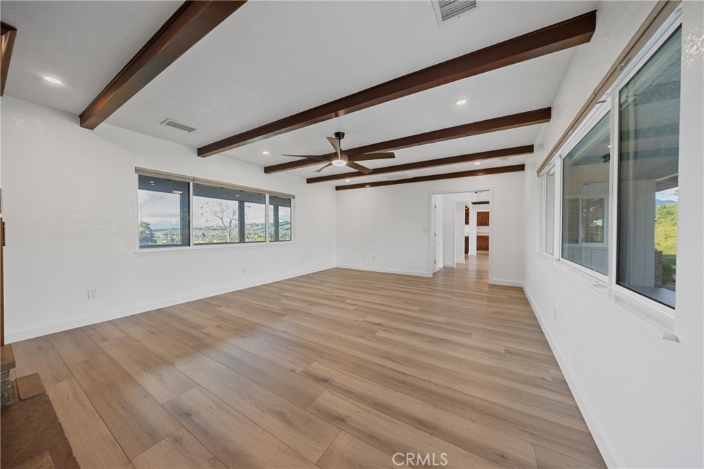 12646 10th Street Yucaipa, CA 92399 - Photo 18 of 72 a big room with wooden floor and windows
