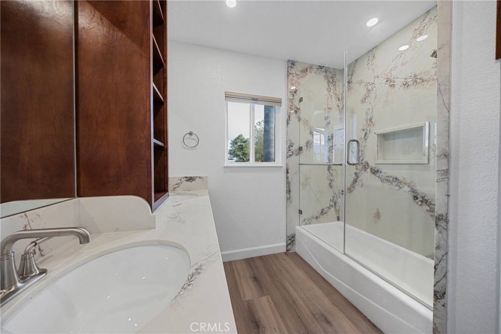 12646 10th Street Yucaipa, CA 92399 - Photo 28 of 72 a bathroom with a bathtub and a shower