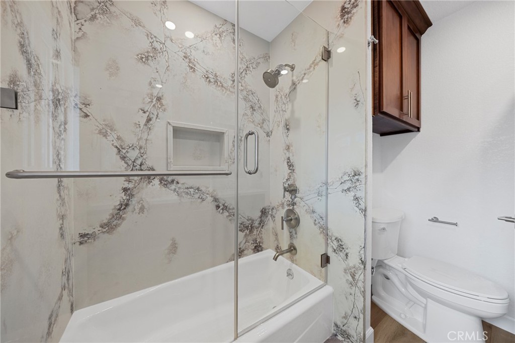 12646 10th Street Yucaipa, CA 92399 - Photo 29 of 72 a bathroom with a bathtub a toilet and a shower