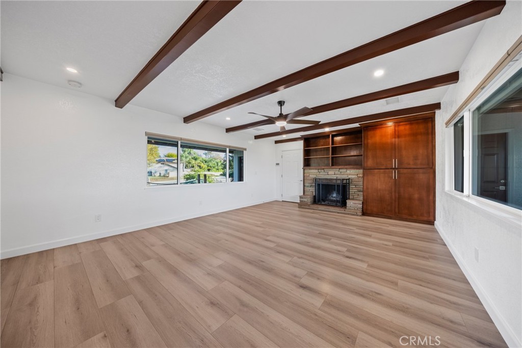 12646 10th Street Yucaipa, CA 92399 - Photo 4 of 72 a view of empty room with wooden floor and fireplace