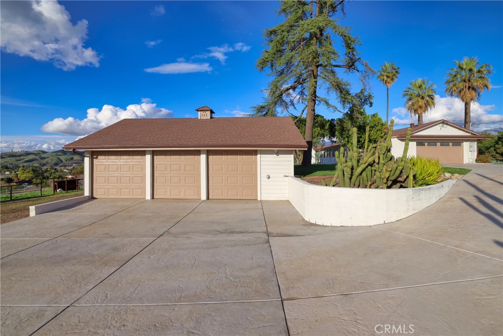 12646 10th Street Yucaipa, CA 92399 - Photo 49 of 72 a view of a house with a yard and potted plants