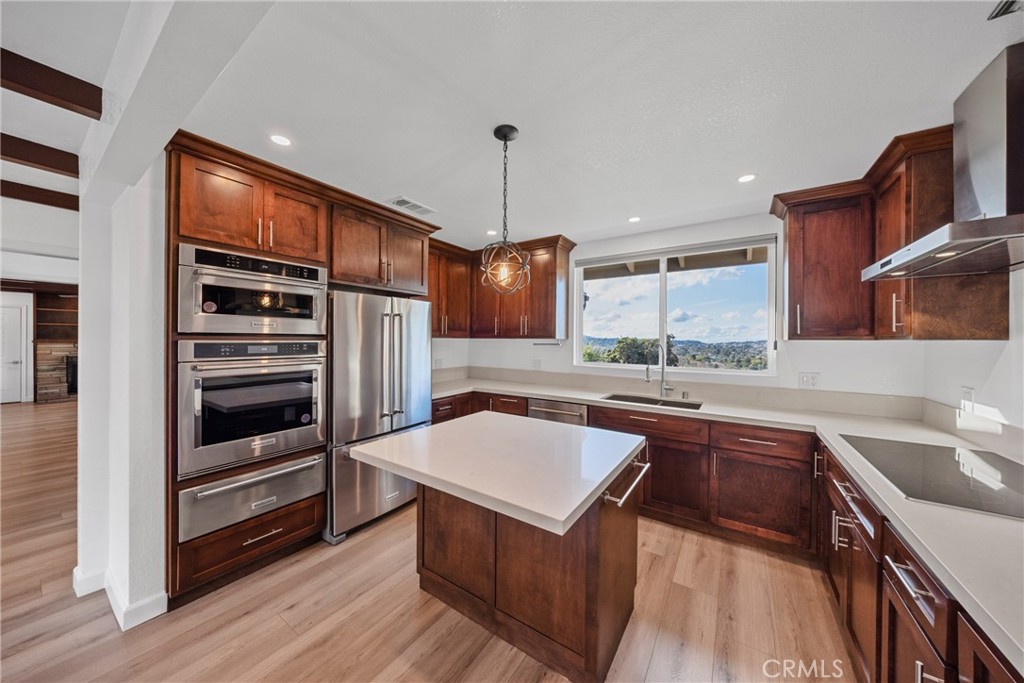 12646 10th Street Yucaipa, CA 92399 - Photo 5 of 72 a kitchen with stainless steel appliances granite countertop a sink and a stove