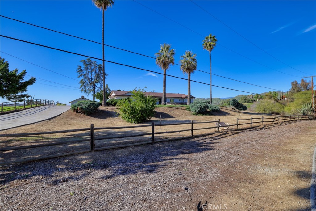 12646 10th Street Yucaipa, CA 92399 - Photo 69 of 72 a view of a bench in a yard
