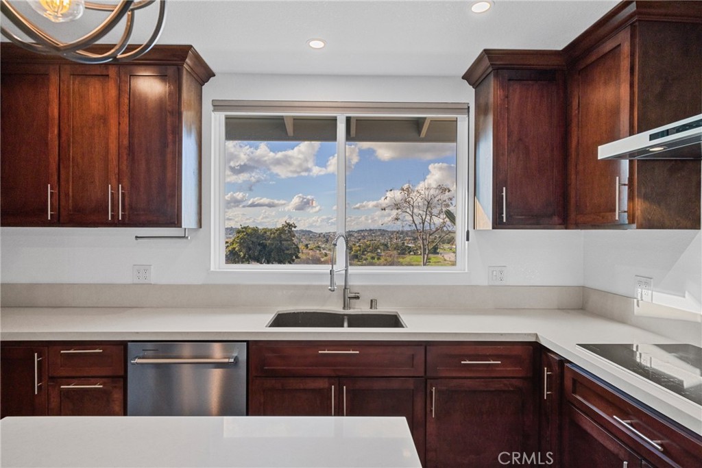 12646 10th Street Yucaipa, CA 92399 - Photo 10 of 72 a kitchen with stainless steel appliances granite countertop a sink and a microwave
