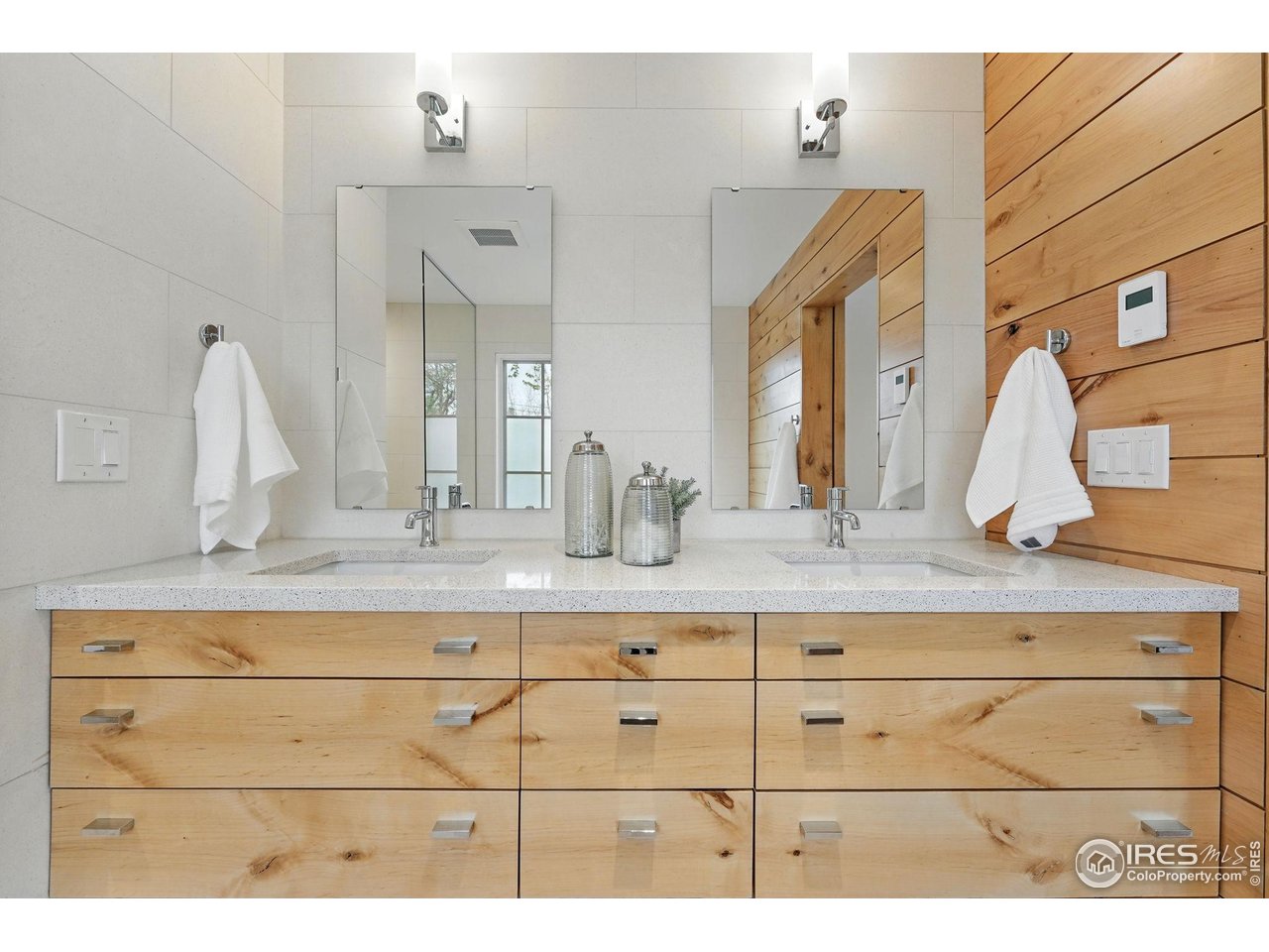 2970 21st Street Boulder, CO 80304 - Photo 24 of 33 a bathroom with a sink vanity and mirror