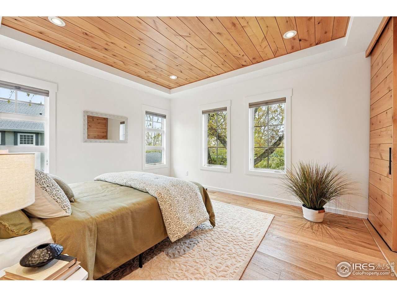 2970 21st Street Boulder, CO 80304 - Photo 3 of 33 a spacious bedroom with a bed a rug and a window