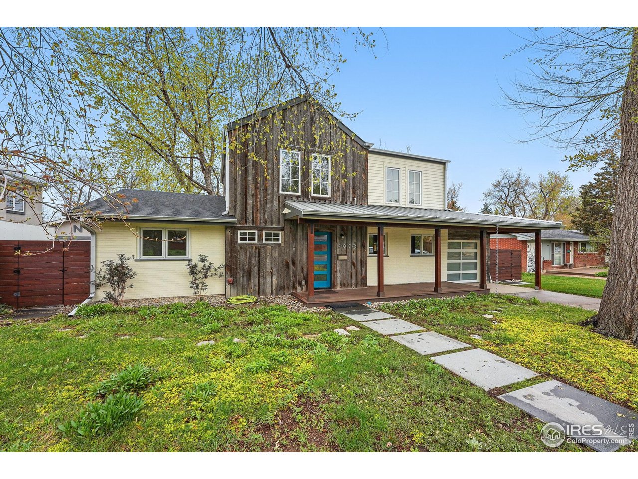 2970 21st Street Boulder, CO 80304 - Photo 32 of 33 a view of a yard in front of a house with a large tree