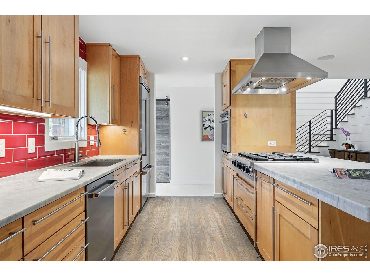 2970 21st Street Boulder, CO 80304 - Photo 8 of 33 a kitchen with stainless steel appliances granite countertop a stove and a sink