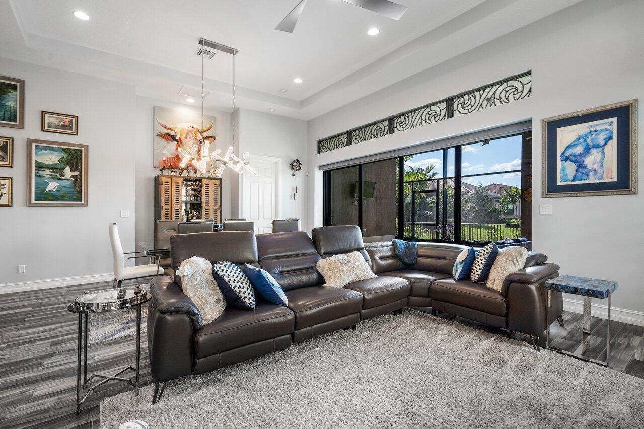 11792 Leon Circle Parkland, FL 33076 - Photo 11 of 51 a living room with furniture and a large window