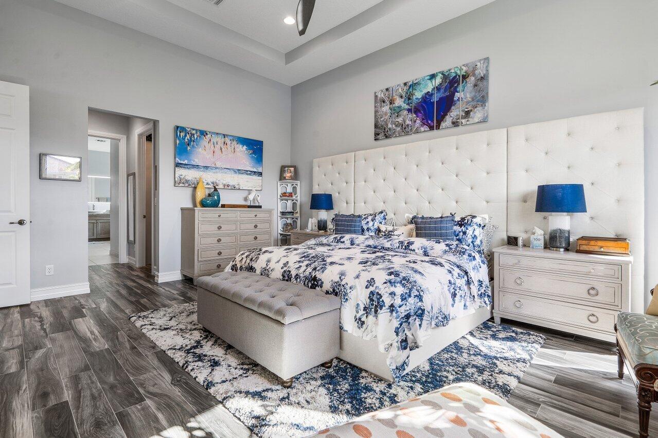 11792 Leon Circle Parkland, FL 33076 - Photo 14 of 51 a bed room with furniture and painting on the wall