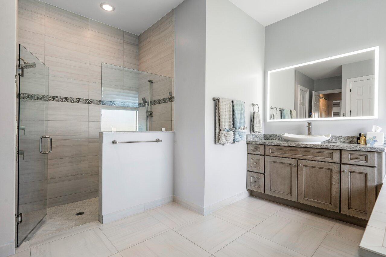 11792 Leon Circle Parkland, FL 33076 - Photo 16 of 51 a bathroom with a granite countertop sink mirror and toilet