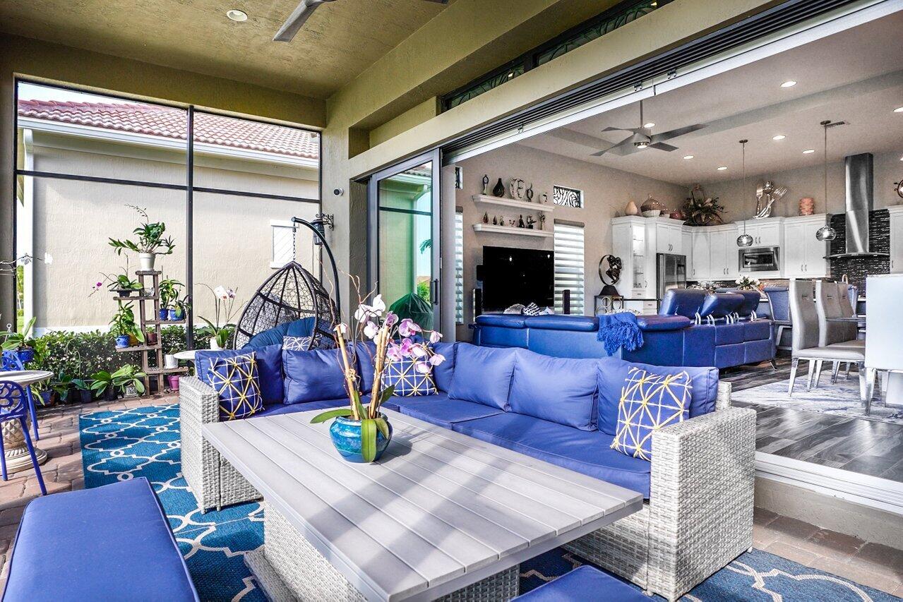 11792 Leon Circle Parkland, FL 33076 - Photo 24 of 51 a living room with furniture fireplace and a large window
