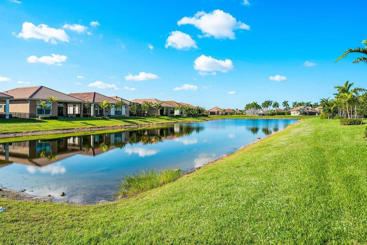 11792 Leon Circle Parkland, FL 33076 - Photo 33 of 51 a view of a house with outdoor space and lake view