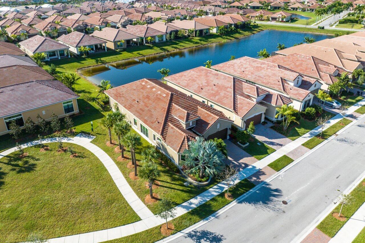 11792 Leon Circle Parkland, FL 33076 - Photo 34 of 51 an aerial view of a house with a garden and lake view