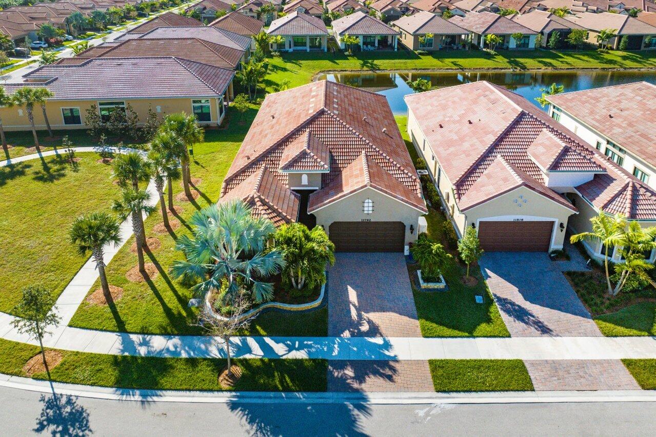 11792 Leon Circle Parkland, FL 33076 - Photo 35 of 51 an aerial view of multiple houses with yard
