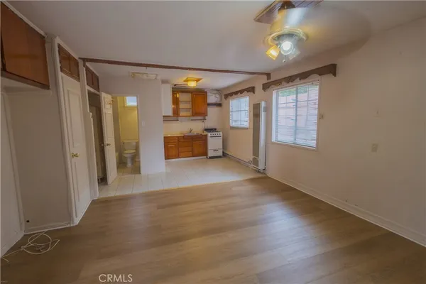 a view of livingroom with hardwood floor and a ceiling fan
