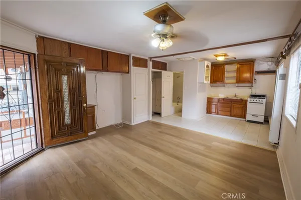 a kitchen with a stove and a refrigerator
