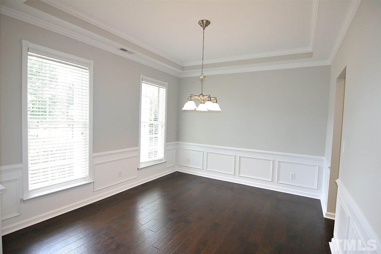 3401 Parlor Street Raleigh, NC 27614 - Photo 4 of 25 a view of empty room with wooden floor and fan