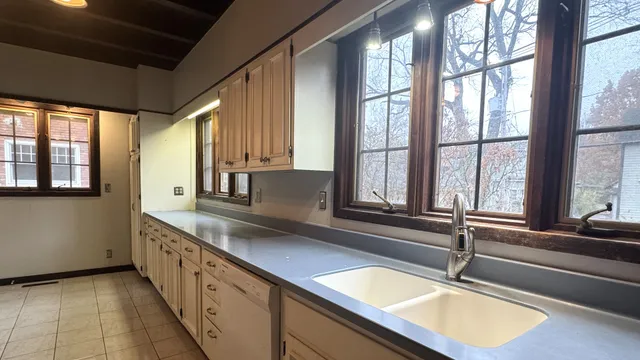 a view of kitchen with furniture and a wooden floor
