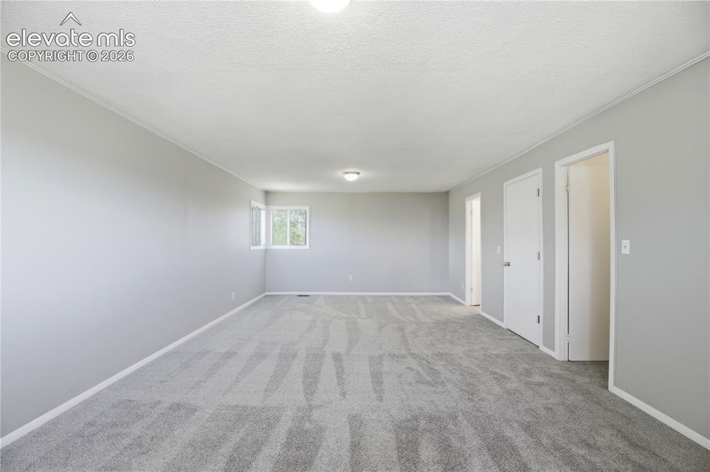 19027 Murphy Road Peyton, CO 80831 - Photo 20 of 48 Carpet, Dual Closets, Primary Bath, Large Room, Windows All Around