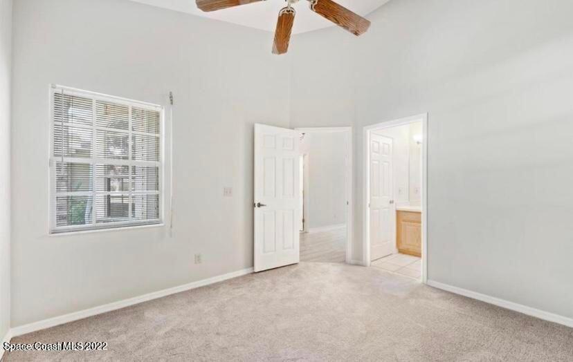 468 Prestwick Court Melbourne, FL 32940 - Photo 4 of 13 an empty room with windows