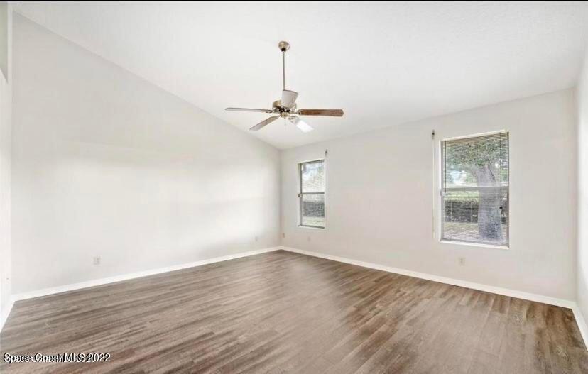 468 Prestwick Court Melbourne, FL 32940 - Photo 7 of 13 a view of a room with wooden floor and window