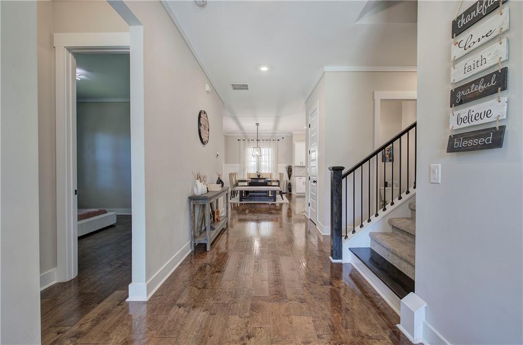 503 London Road Ball Ground, GA 30107 - Photo 3 of 55 a view of a hallway view with wooden floor and staircase