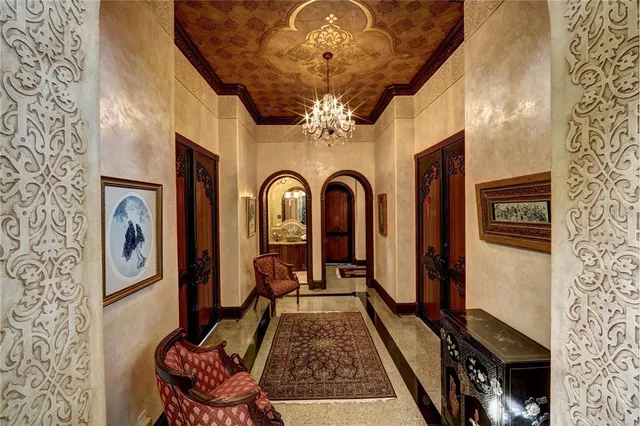 a view of hall way with furniture