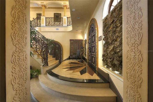 a bedroom with a large bed and flat screen tv
