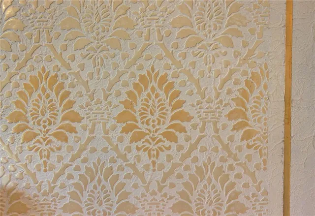 a view of a swimming pool with a patio and a garden