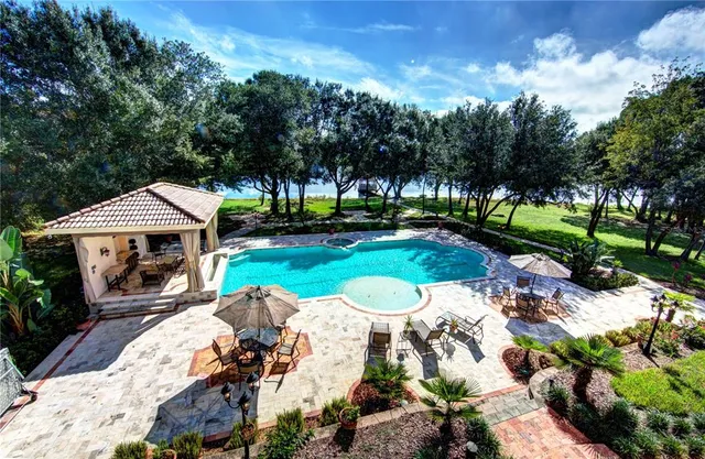 a view of a lake with a house in the background