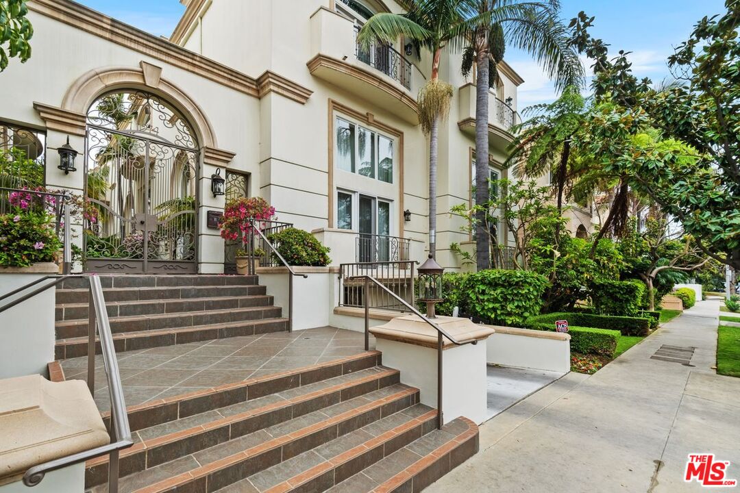 11974 Mayfield Avenue, Unit 2 Los Angeles, CA 90049 - Photo 14 of 26 a view of a building with a porch