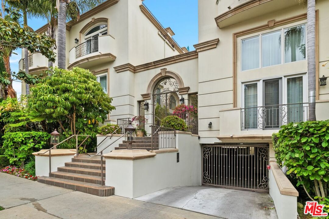 11974 Mayfield Avenue, Unit 2 Los Angeles, CA 90049 - Photo 15 of 26 a view of a tall building with a tree in front of it