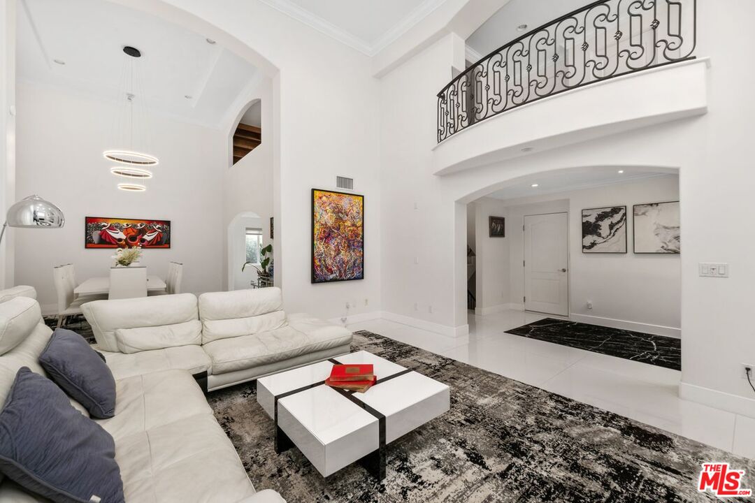 11974 Mayfield Avenue, Unit 2 Los Angeles, CA 90049 - Photo 4 of 26 a living room with furniture and a rug