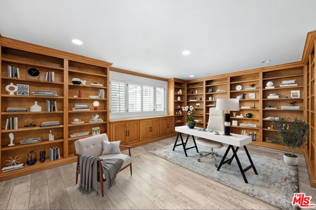 11974 Mayfield Avenue, Unit 2 Los Angeles, CA 90049 - Photo 5 of 26 a workspace with furniture window and wooden floor