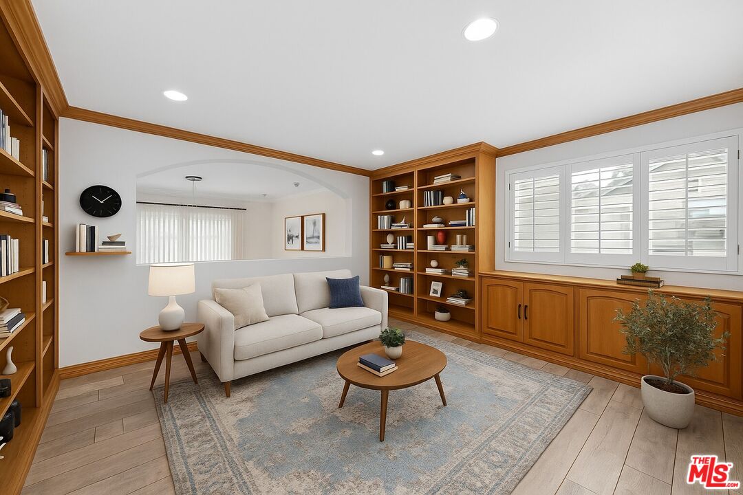 11974 Mayfield Avenue, Unit 2 Los Angeles, CA 90049 - Photo 6 of 26 a living room with furniture and a large window