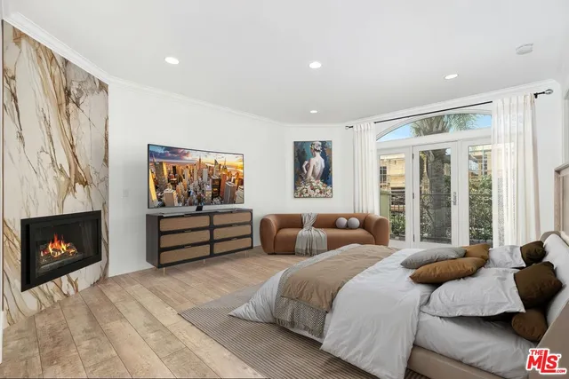 a bedroom with a bed and a fireplace