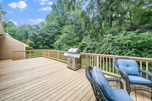 a view of a deck with furniture and wooden floor