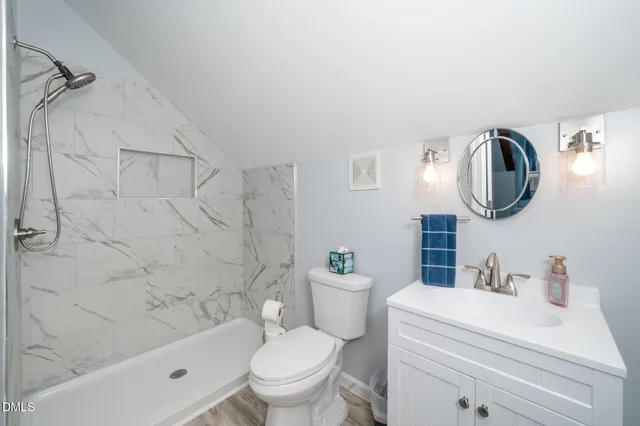 a bedroom with a bed and windows