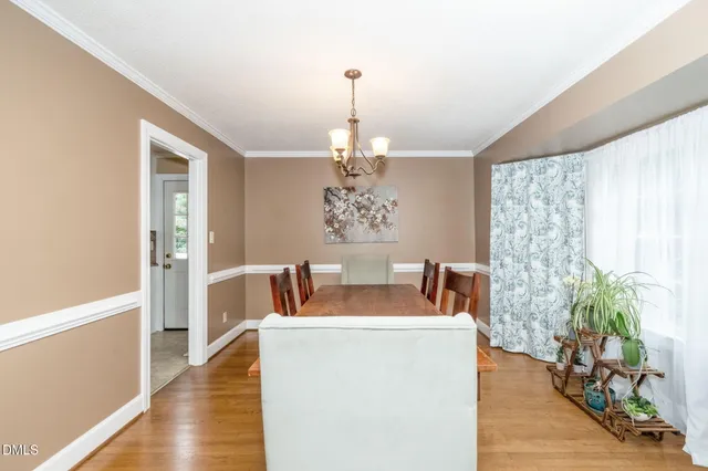 a kitchen with stainless steel appliances a refrigerator and a stove top oven