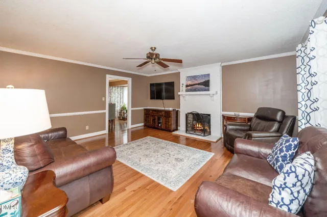 a living room with furniture and a rug